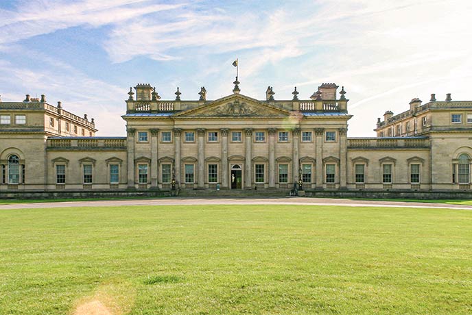 Looking across a lawn at the historic Harewood House in Yorkshire