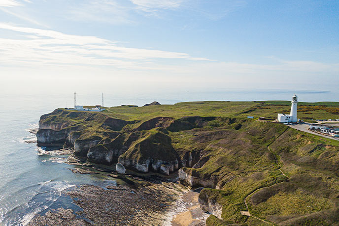 A bird's eye view of Flamborough Head and lighthouse
