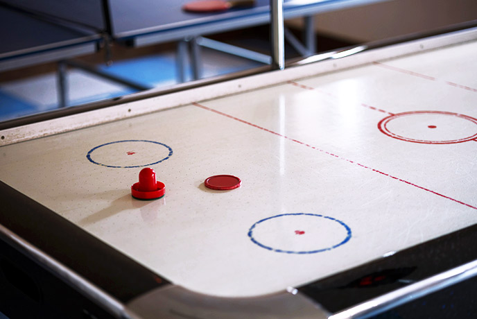 An air hockey table in a games room