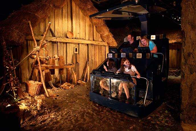 People riding past Viking figures on the ride at JORVIK Viking Centre in Yorkshire